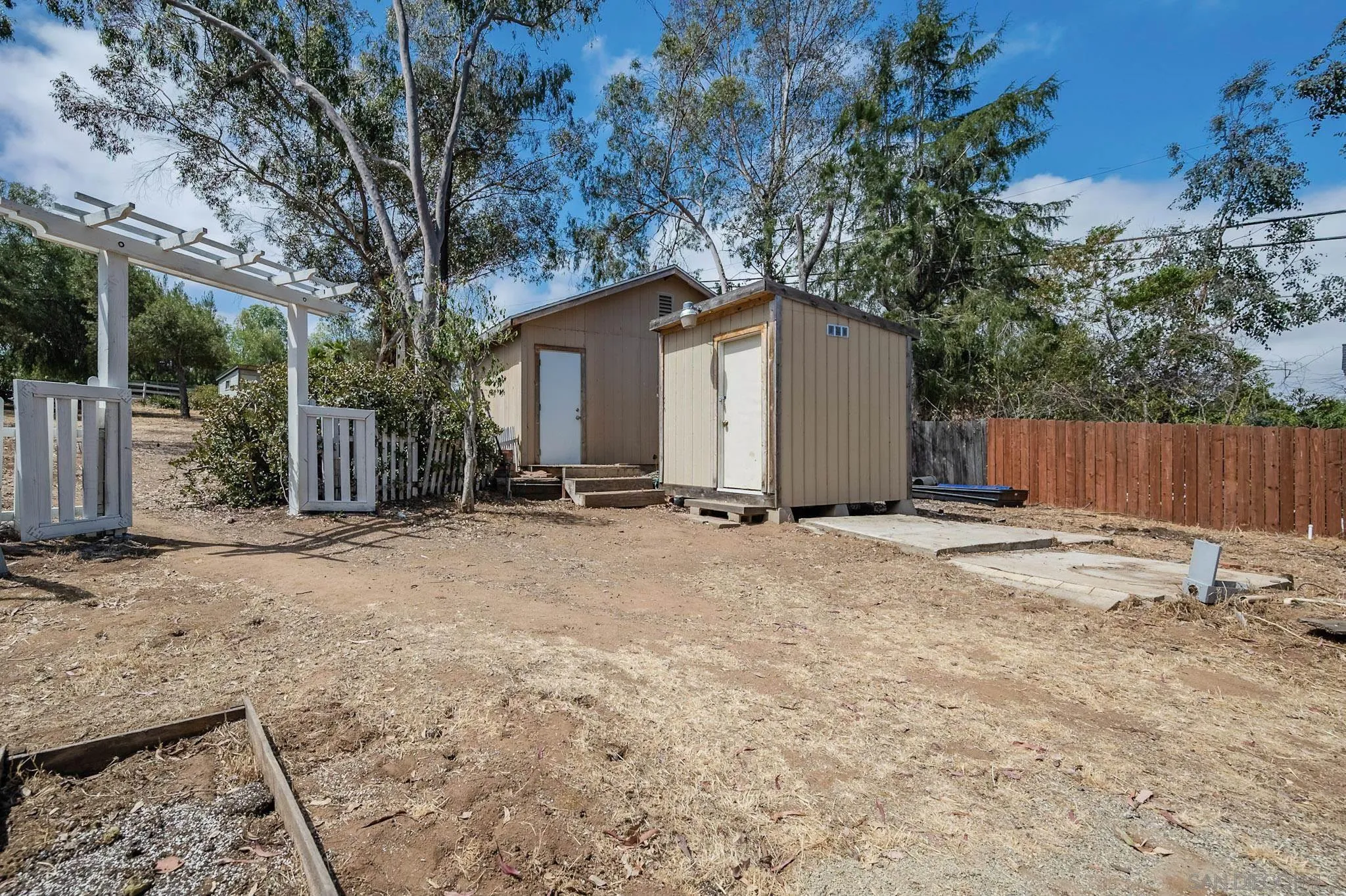 1367 Green Canyon Road Fallbrook, CA 92028 - Photo 30 of 42 a view of a house with a yard