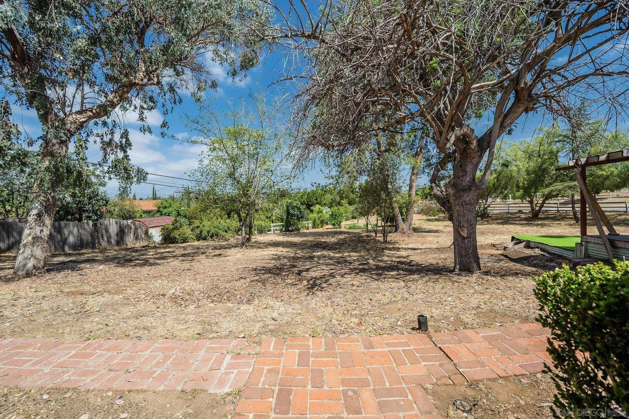 1367 Green Canyon Road Fallbrook, CA 92028 - Photo 33 of 42 a view of a yard with plants and trees