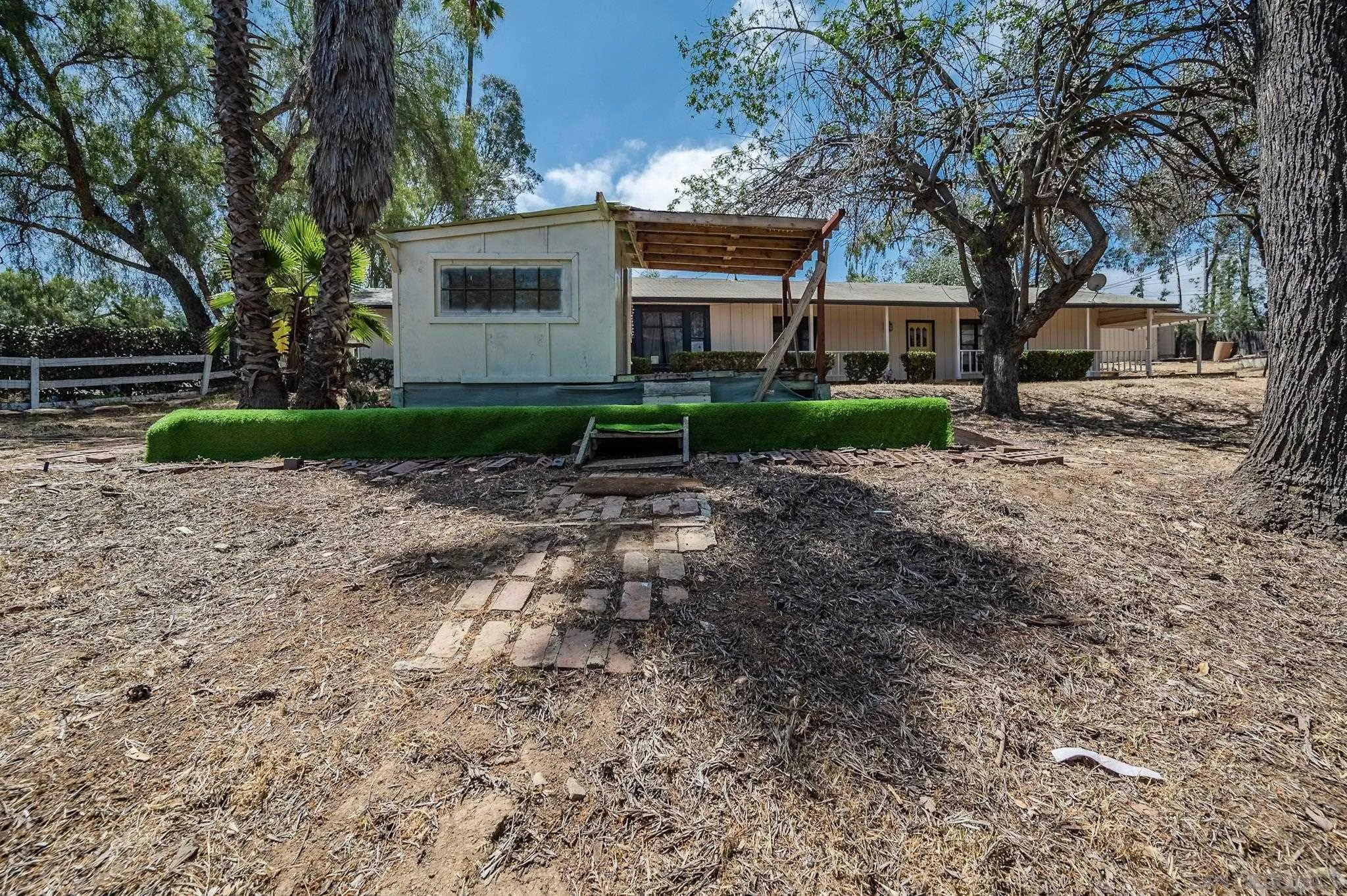 1367 Green Canyon Road Fallbrook, CA 92028 - Photo 34 of 42 a view of a house with a yard