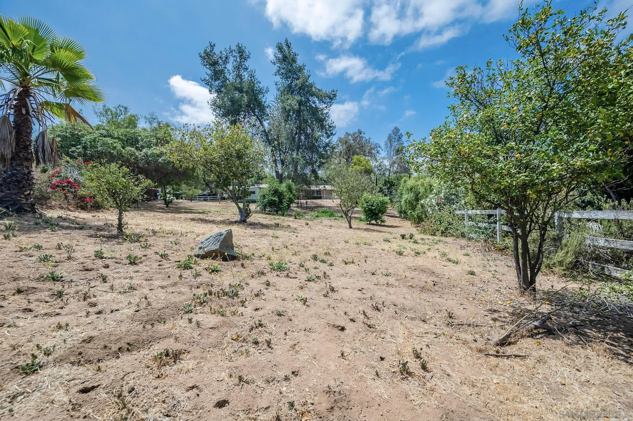 1367 Green Canyon Road Fallbrook, CA 92028 - Photo 35 of 42 a view of dirt road with a building in the background