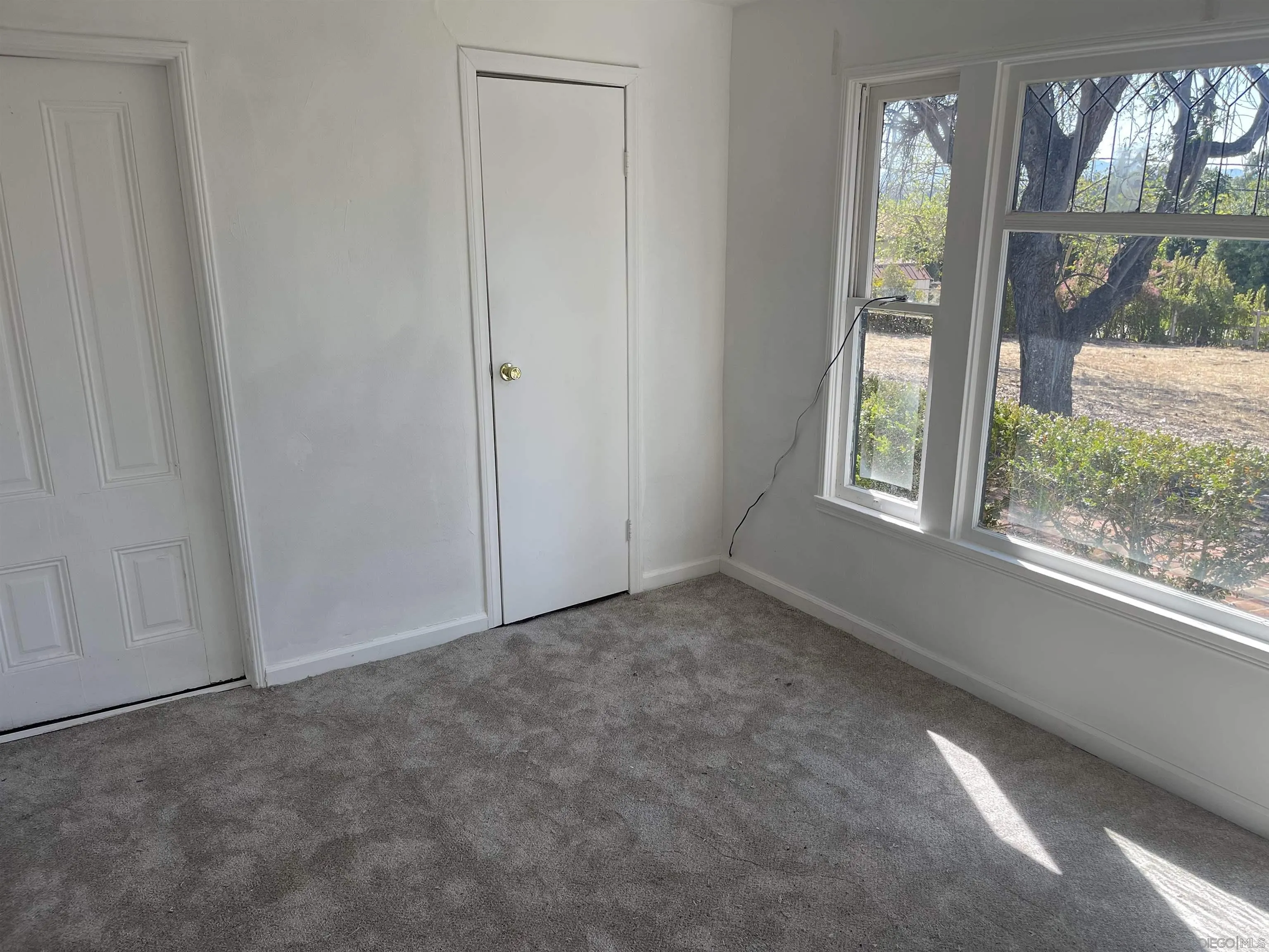1367 Green Canyon Road Fallbrook, CA 92028 - Photo 9 of 42 an empty room with windows
