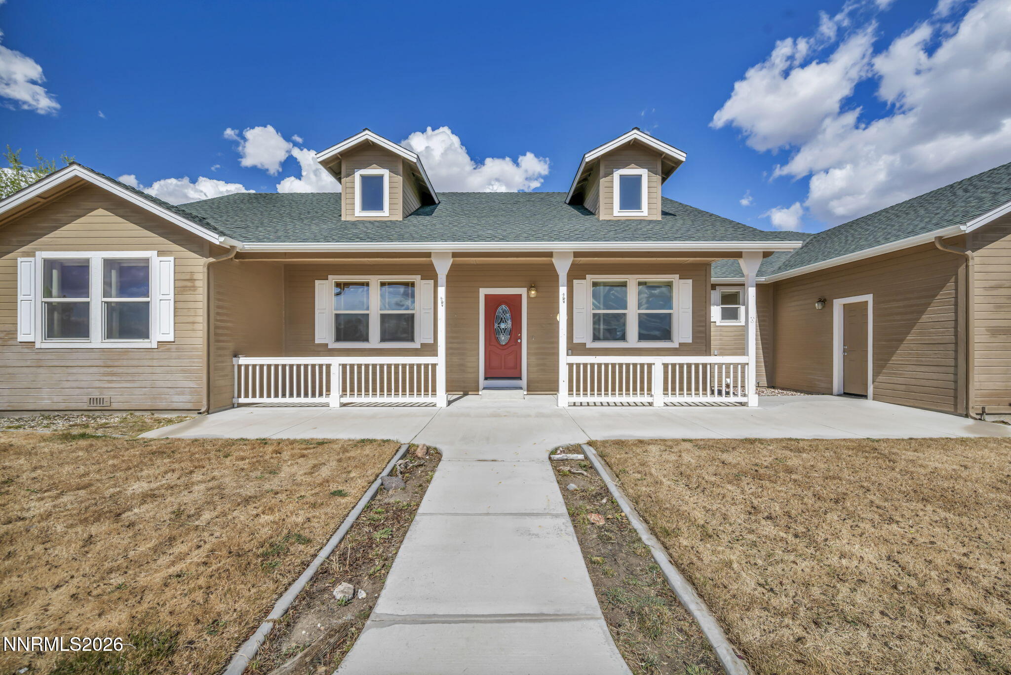 68 Kari Lane Smith Valley, NV 89430 - Photo 1 of 42 a front view of a house with a yard