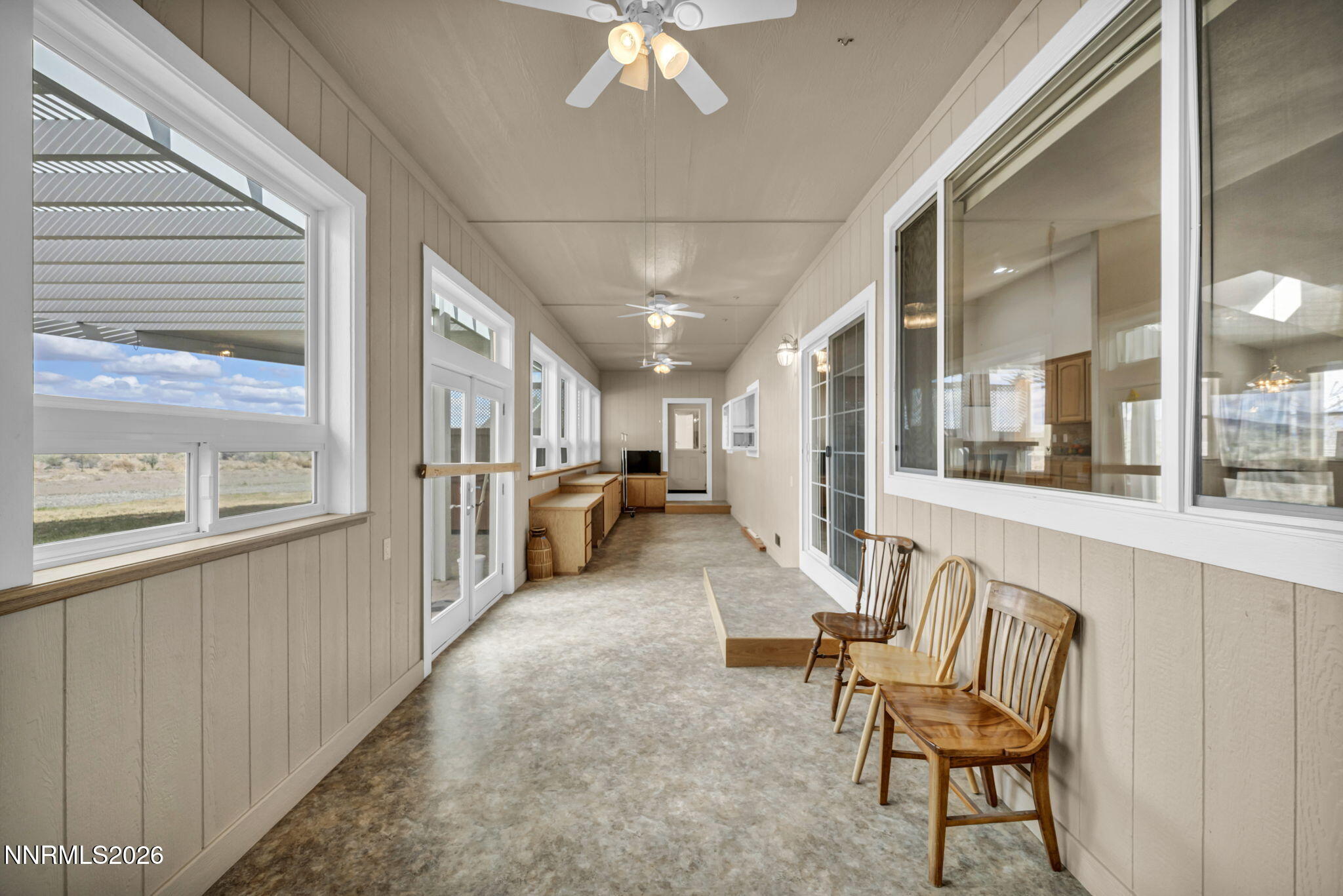 68 Kari Lane Smith Valley, NV 89430 - Photo 21 of 42 a view of a hallway with furniture and a chandelier