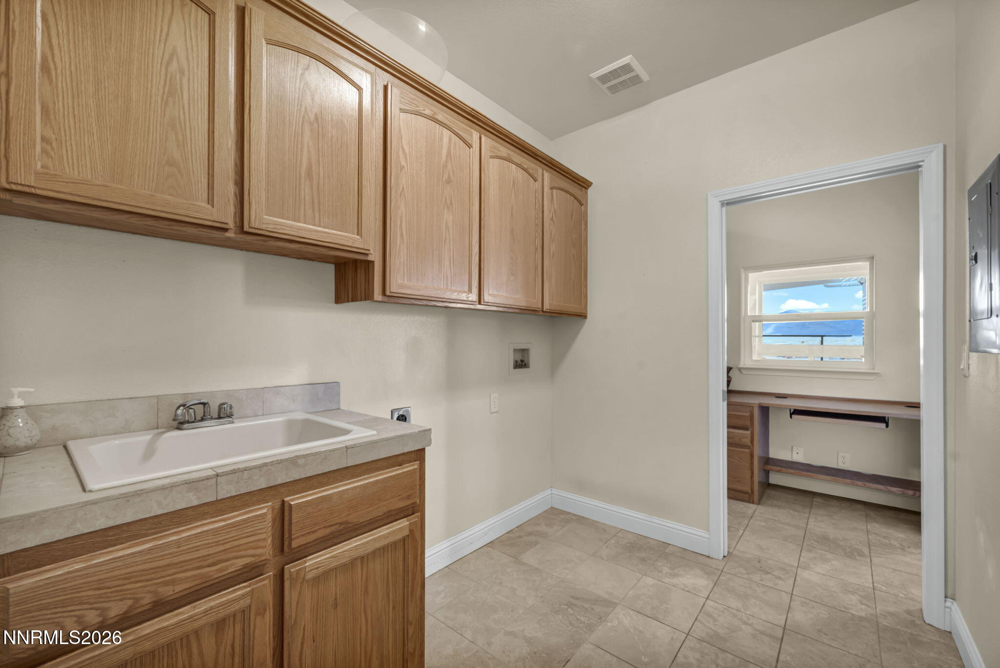 68 Kari Lane Smith Valley, NV 89430 - Photo 23 of 42 a kitchen with a sink and cabinets