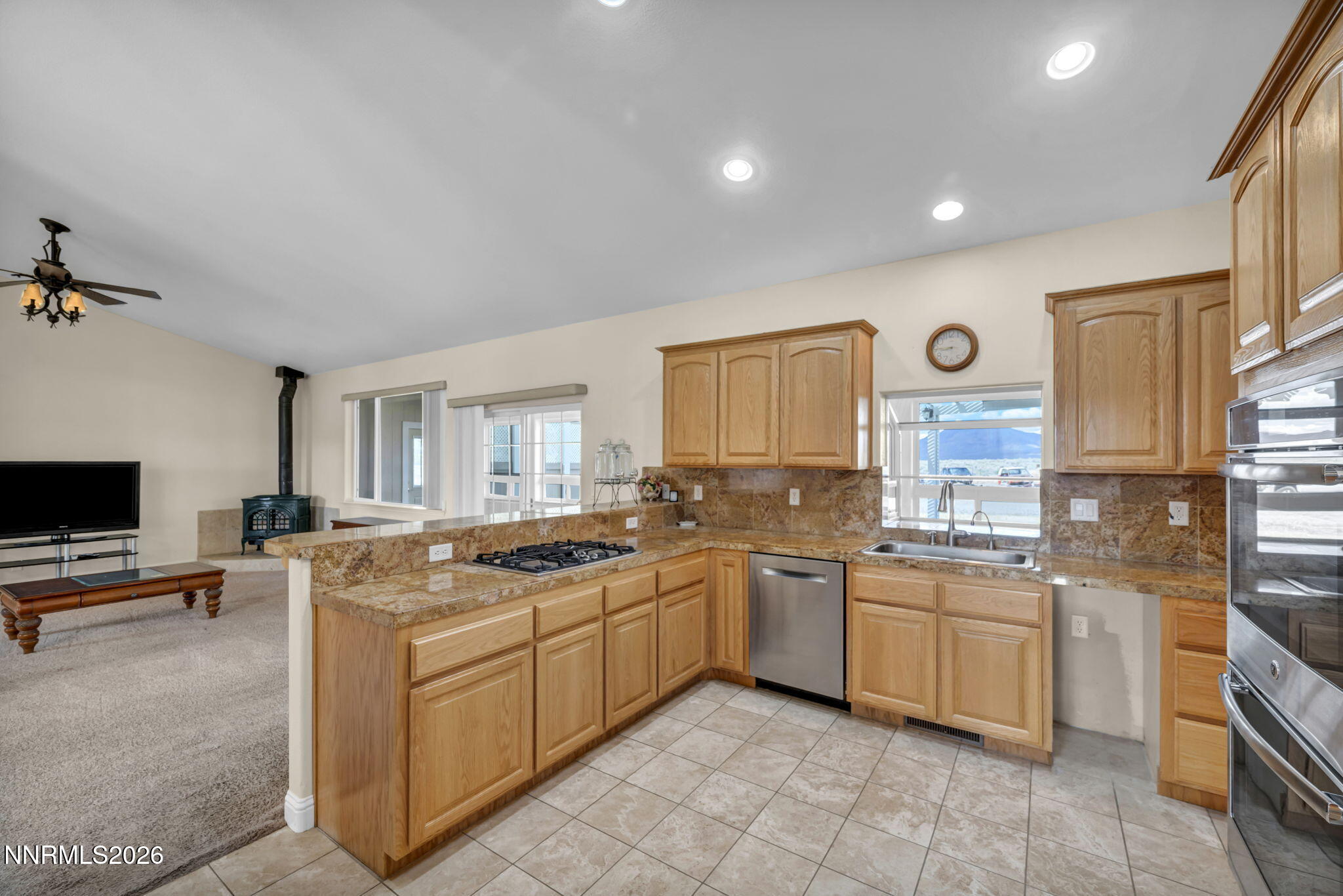 68 Kari Lane Smith Valley, NV 89430 - Photo 4 of 42 a kitchen with a sink stove and cabinets