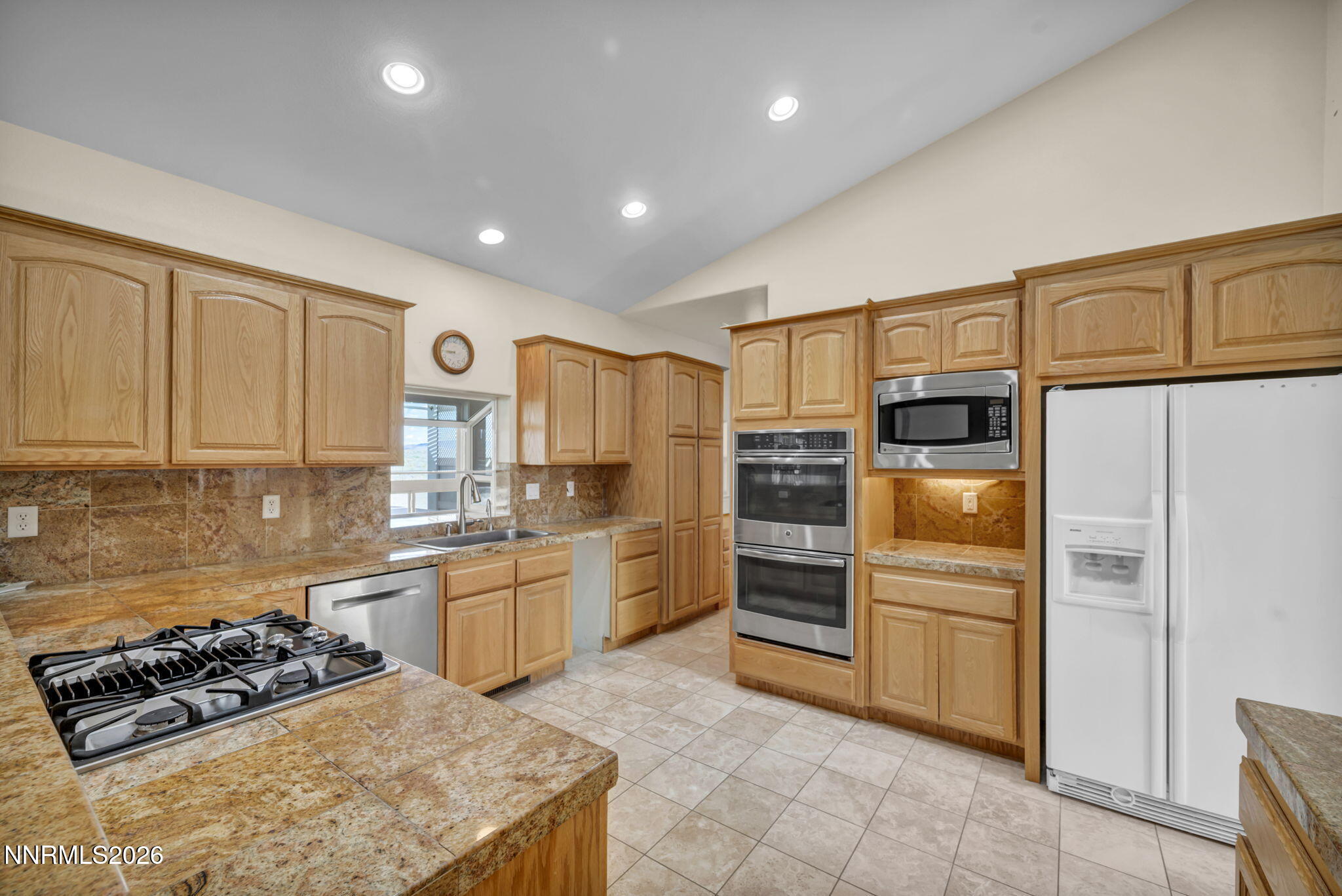 68 Kari Lane Smith Valley, NV 89430 - Photo 5 of 42 a kitchen with cabinets and stainless steel appliances