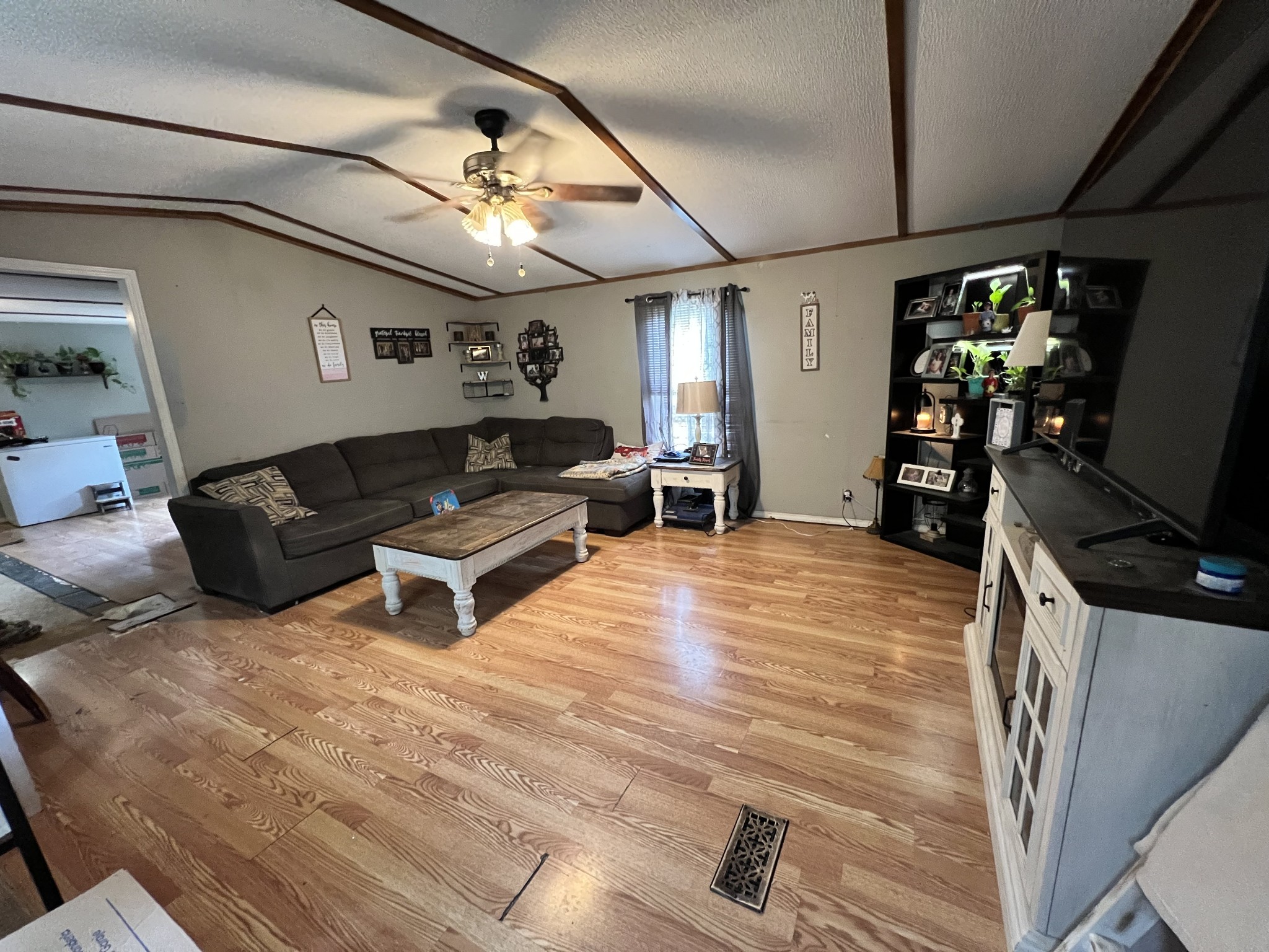 10338 Chappell Cemetery Road Bon Aqua, TN 37025 - Photo 13 of 21 a living room with furniture and a flat screen tv