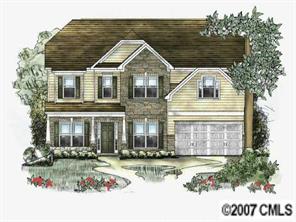 2002 Potomac Road, Unit 72 Indian Trail, NC 28079 - Photo 1 of 1 a front view of a house with a yard table and chairs