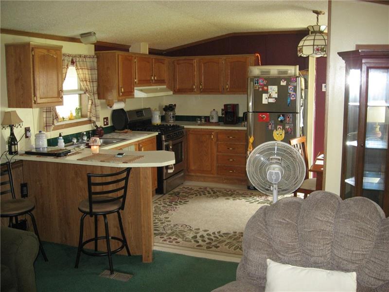 216 Edsel Drive Ruffs Dale, PA 15679 - Photo 7 of 17 Kitchen Appliances included Refrigerator and Gas Stove.
