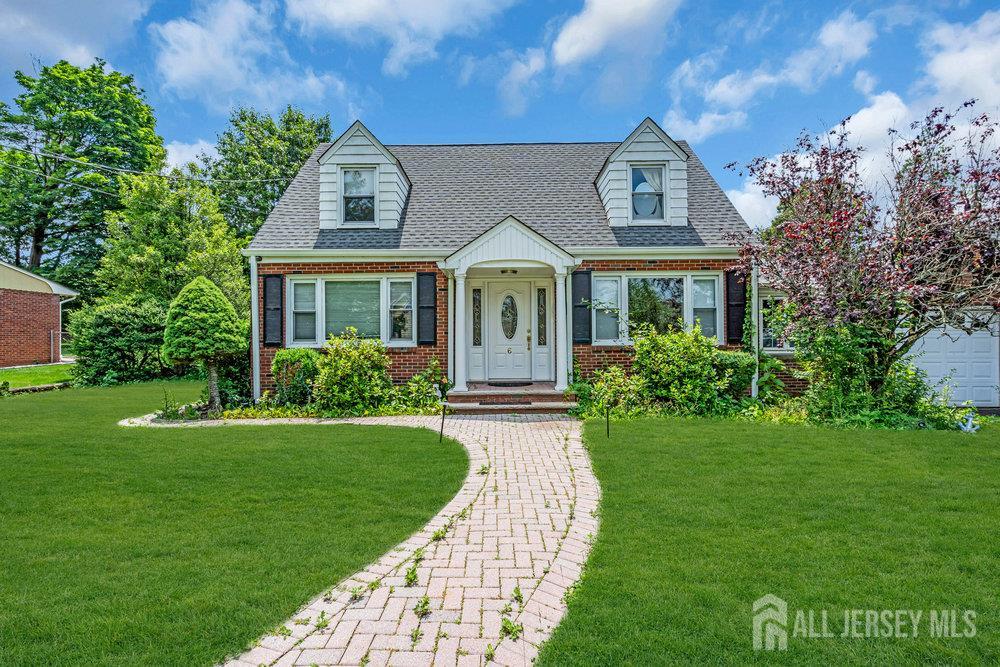 6 Carpender Road New Brunswick, NJ 08901 - Photo 1 of 30 a front view of a house with a yard