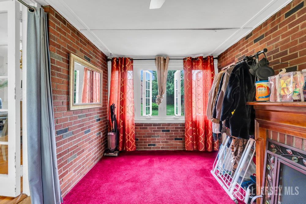 6 Carpender Road New Brunswick, NJ 08901 - Photo 11 of 30 a view of walk in closet with clothes and shoes