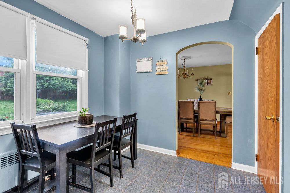 6 Carpender Road New Brunswick, NJ 08901 - Photo 13 of 30 a view of a dining room with furniture and a chandelier