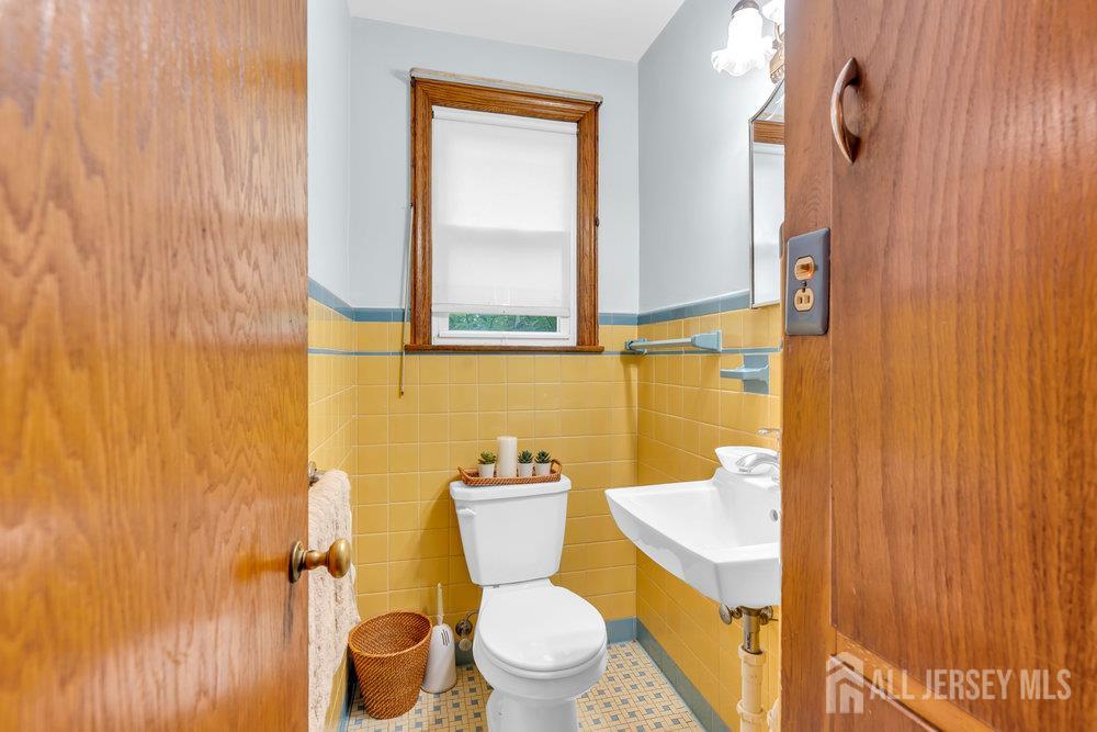 6 Carpender Road New Brunswick, NJ 08901 - Photo 17 of 30 a bathroom with a toilet and a sink