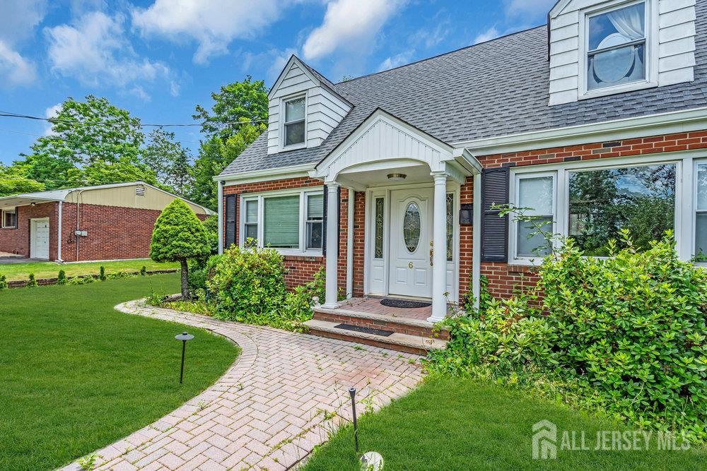 6 Carpender Road New Brunswick, NJ 08901 - Photo 2 of 30 a front view of a house with a yard