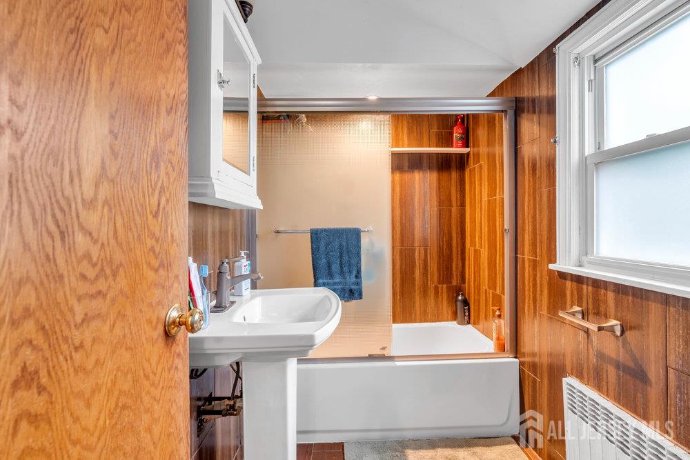 6 Carpender Road New Brunswick, NJ 08901 - Photo 24 of 30 a bathroom with a sink and a mirror