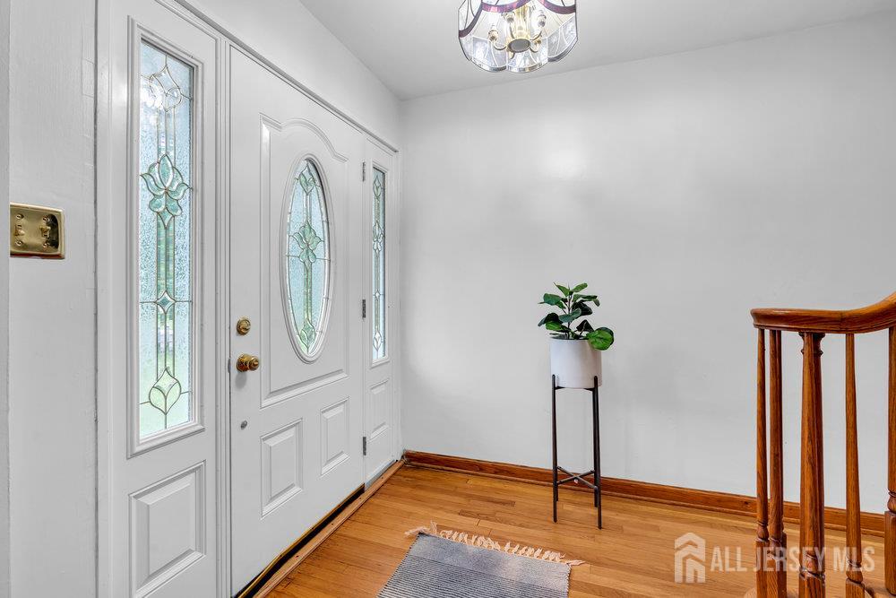 6 Carpender Road New Brunswick, NJ 08901 - Photo 3 of 30 a view of an entryway with wooden floor