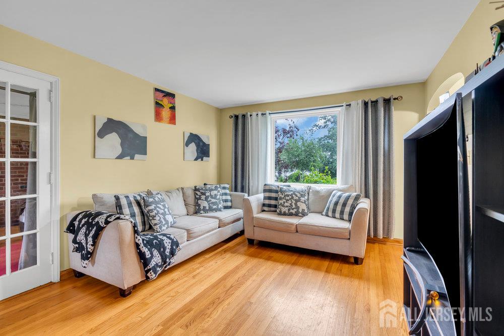 6 Carpender Road New Brunswick, NJ 08901 - Photo 7 of 30 a living room with furniture and a large window