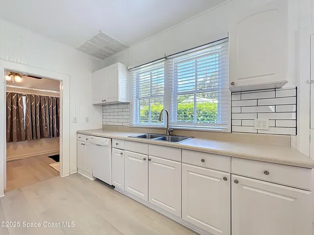 a kitchen with sink and window