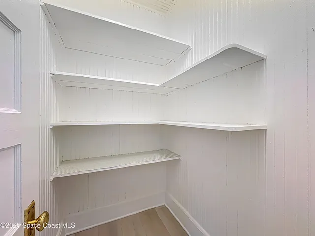a view of an empty walk in closet