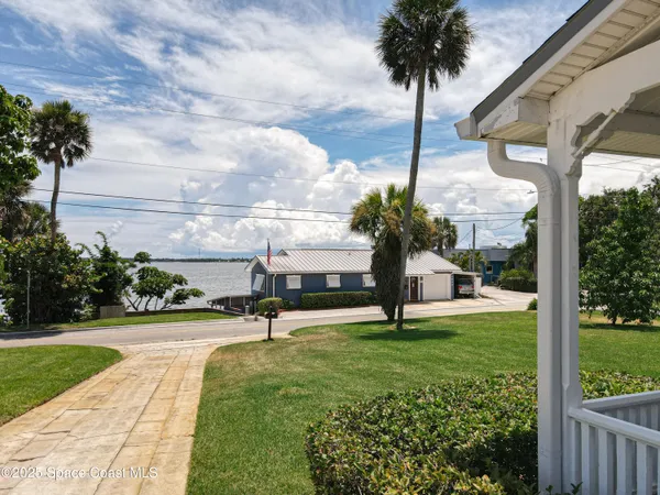 an aerial view of a house with yard