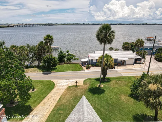 a view of a street with a building in the background