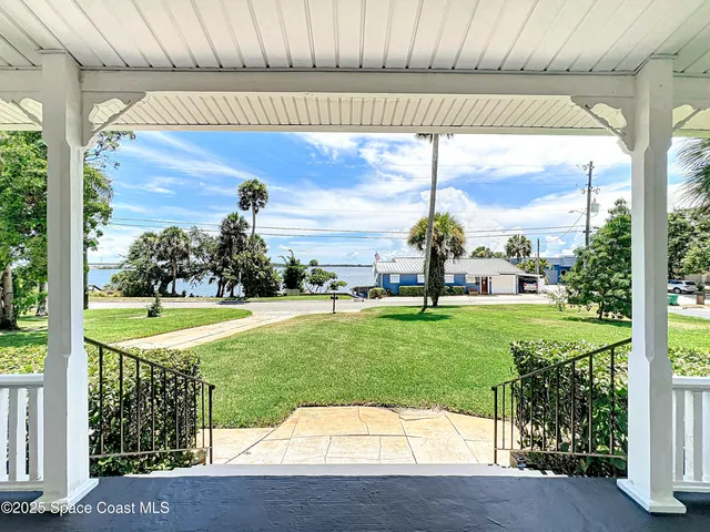 a view of a porch with a garden