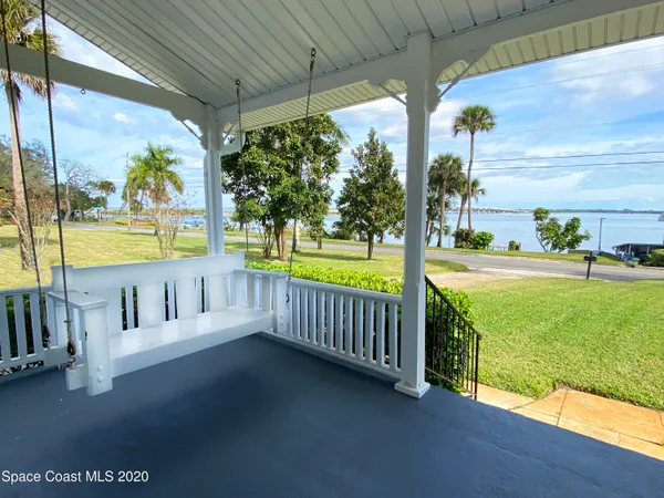 a balcony with furniture and garden