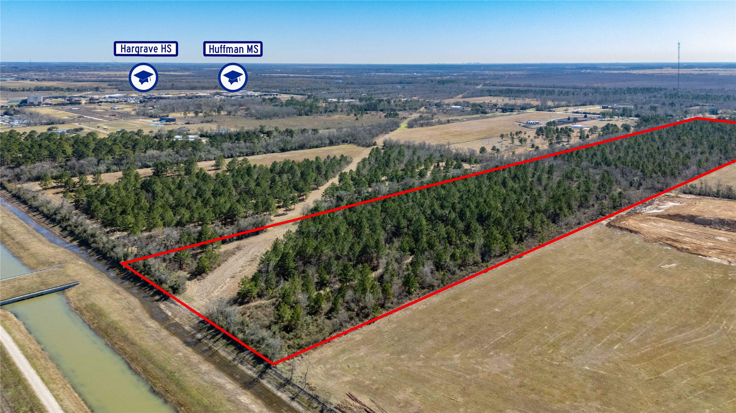 0 Huffman-Eastgate Road Huffman, TX 77336 - Photo 6 of 8 a view of a bunch of flowers and cars