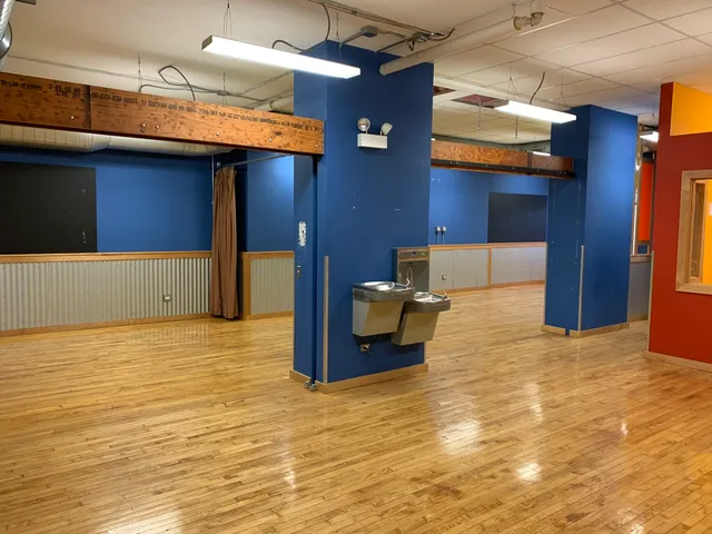 a view of a living room with a kitchen