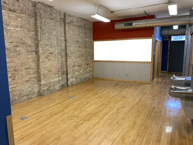 a view of a livingroom with wooden floor