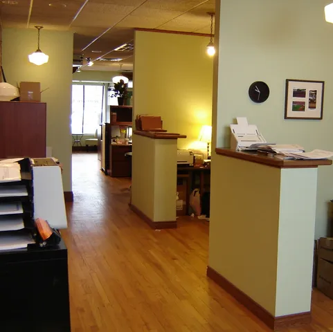 a kitchen with sink and refrigerator