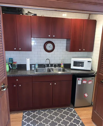 a kitchen with a sink and cabinets