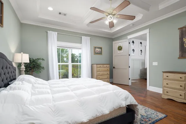 a bedroom with a large bed and a window