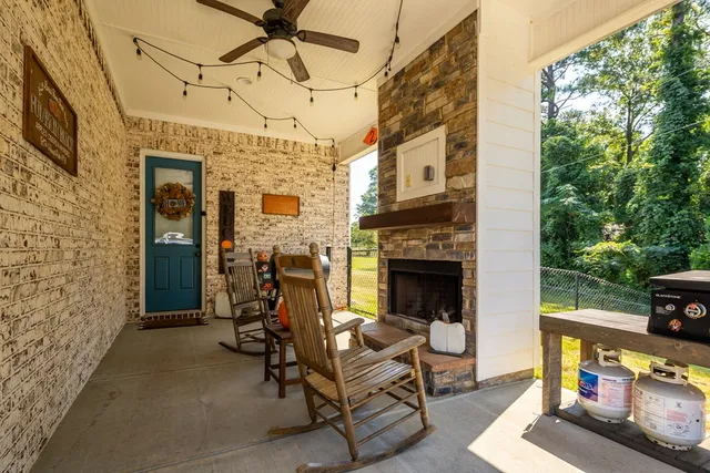 a view of a patio with a table and chairs