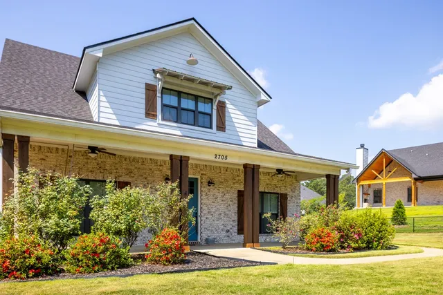 a view of a house with a swimming pool