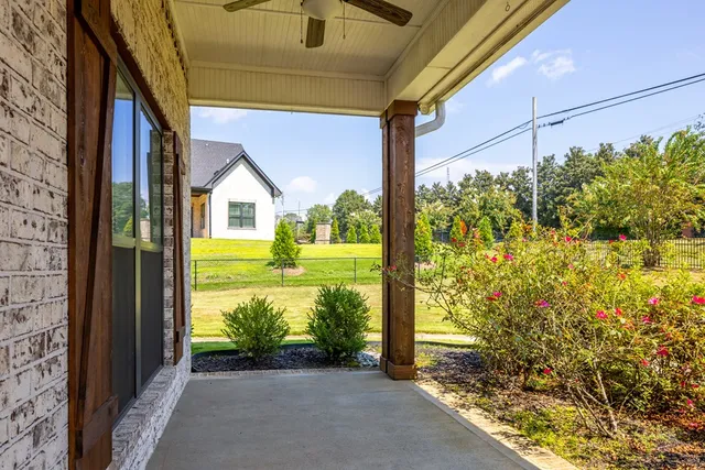 a view of a porch with a big yard