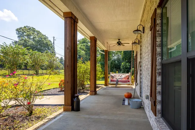 a sitting area with furniture and garden view