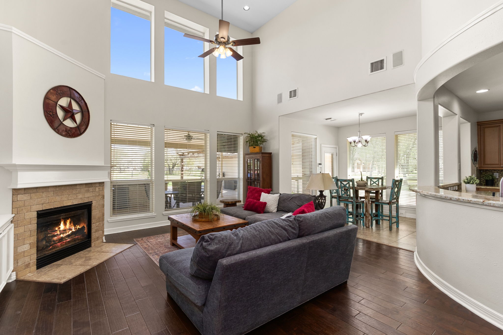 3610 Wellspring Lake Drive Fulshear, TX 77441 - Photo 11 of 45 a living room with furniture a fireplace and wooden floor