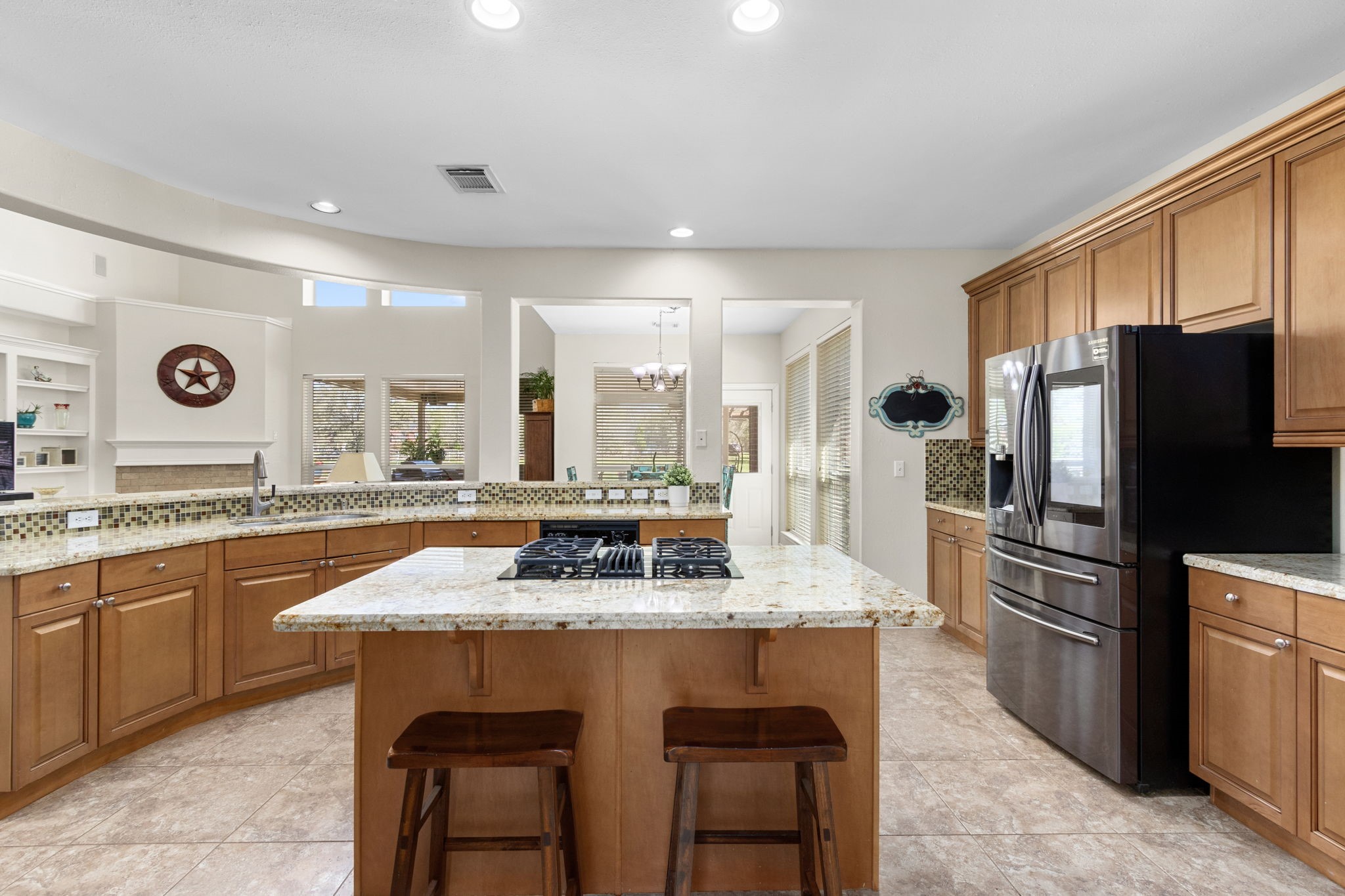 3610 Wellspring Lake Drive Fulshear, TX 77441 - Photo 13 of 45 a large kitchen with granite countertop a stove refrigerator and a sink