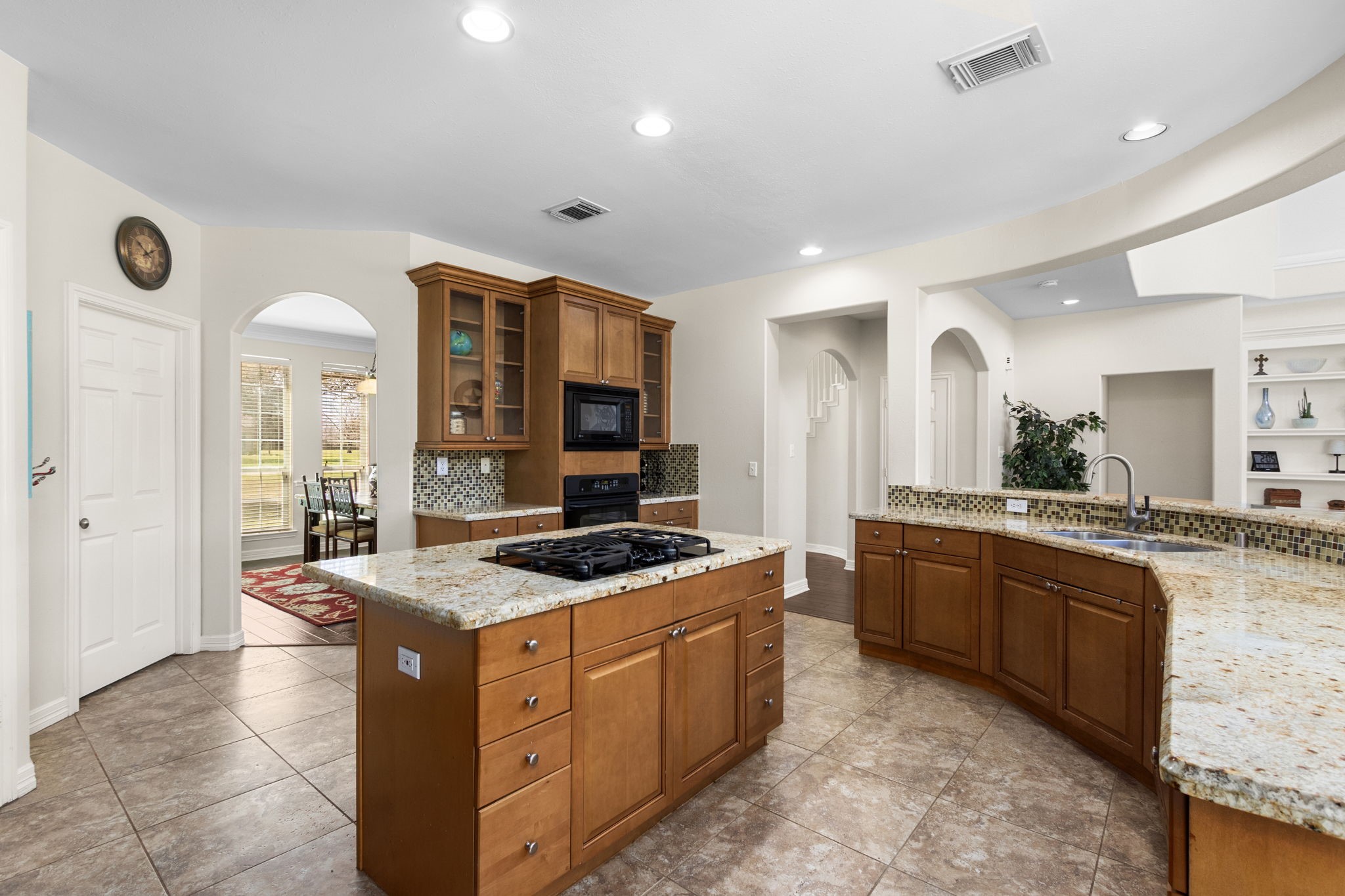 3610 Wellspring Lake Drive Fulshear, TX 77441 - Photo 15 of 45 a kitchen with stainless steel appliances granite countertop a stove a sink and a refrigerator