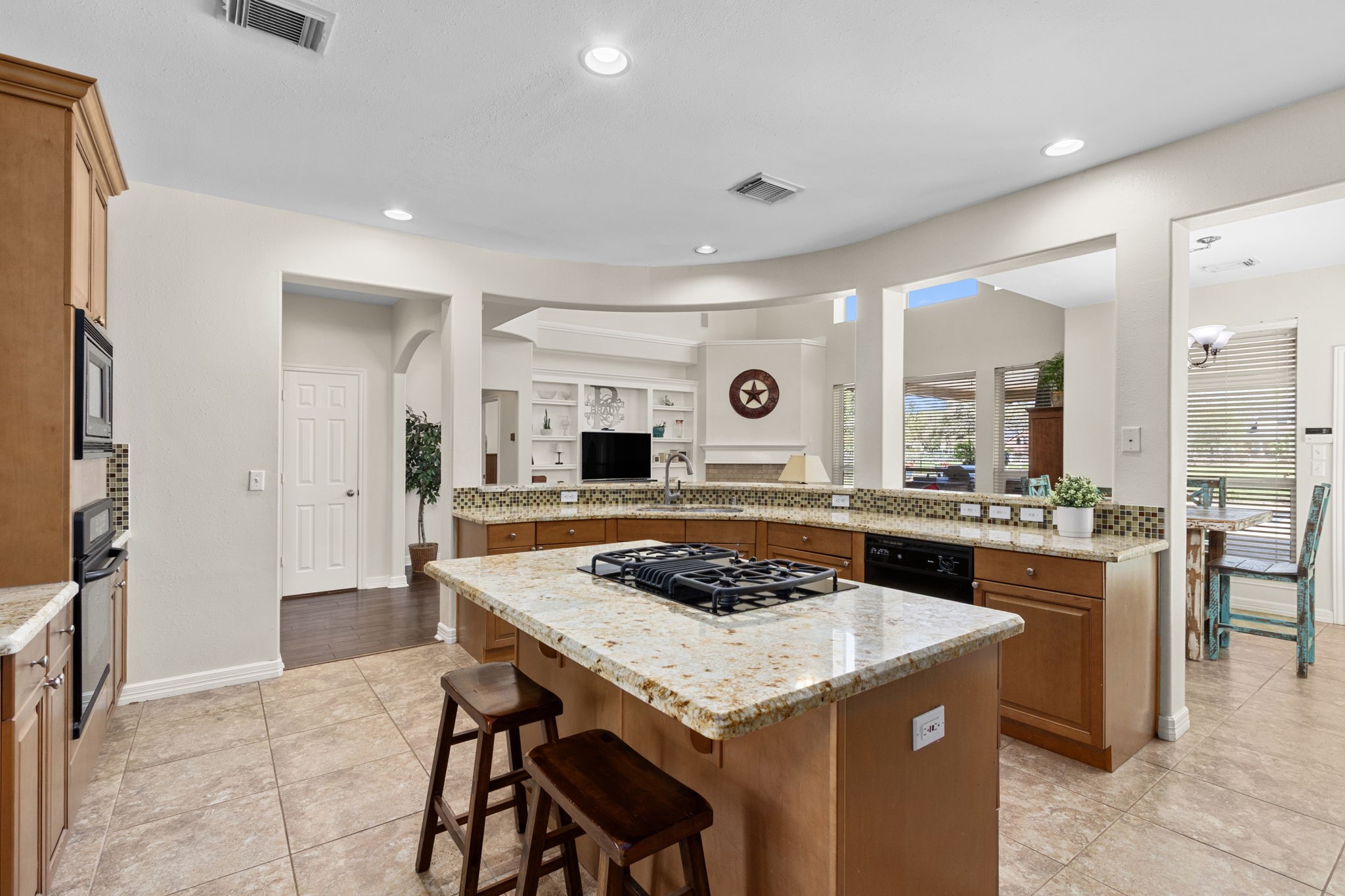 3610 Wellspring Lake Drive Fulshear, TX 77441 - Photo 16 of 45 a kitchen with a table and chairs in it