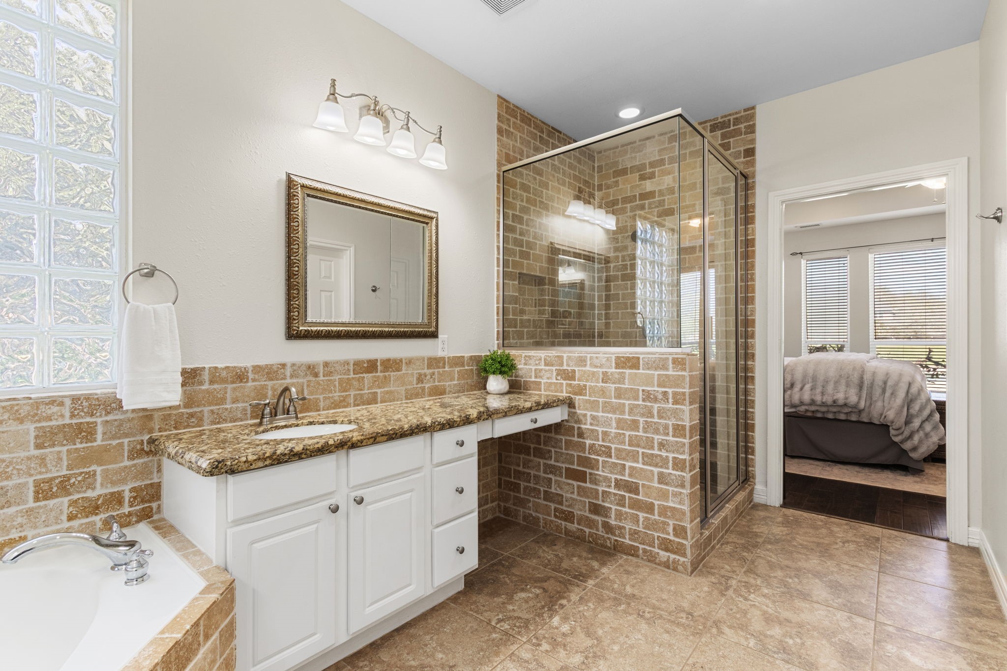 3610 Wellspring Lake Drive Fulshear, TX 77441 - Photo 22 of 45 a bathroom with a sink double vanity and a shower