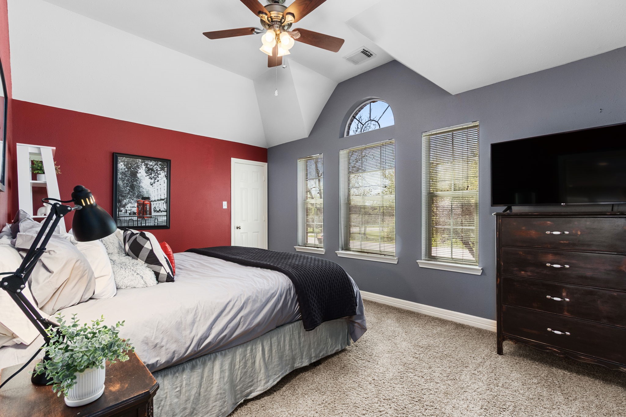 3610 Wellspring Lake Drive Fulshear, TX 77441 - Photo 25 of 45 a bedroom with a bed and a flat tv screen on dresser