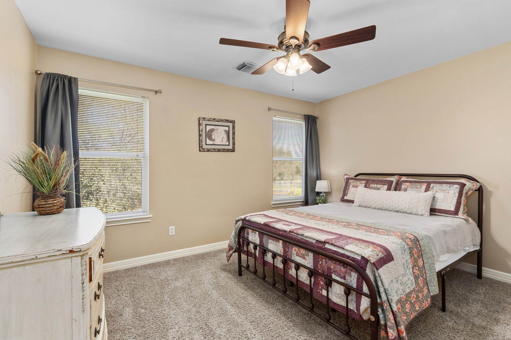 3610 Wellspring Lake Drive Fulshear, TX 77441 - Photo 26 of 45 a bedroom with a bed chandelier and a window
