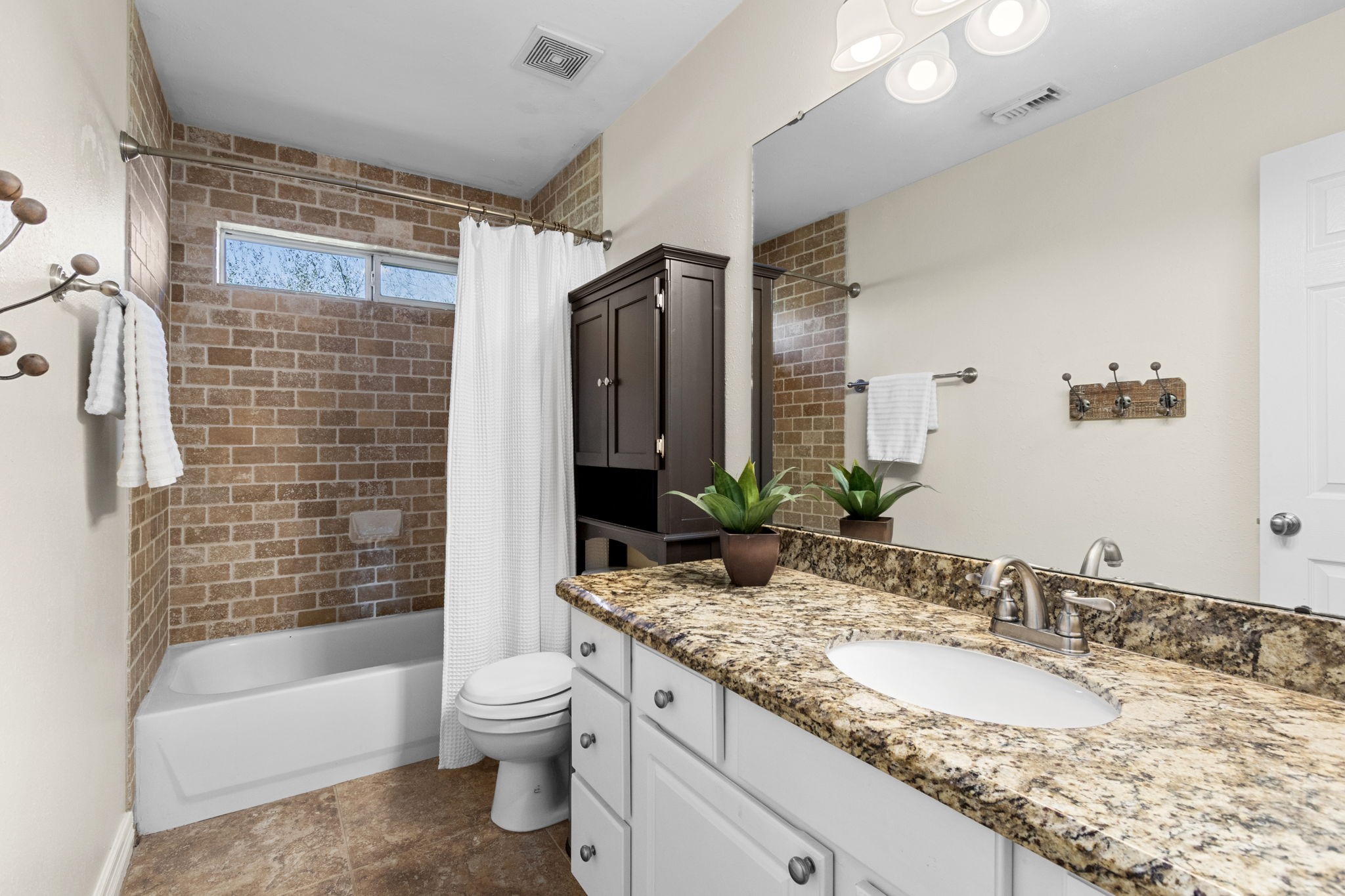 3610 Wellspring Lake Drive Fulshear, TX 77441 - Photo 28 of 45 a bathroom with a granite countertop sink toilet and shower