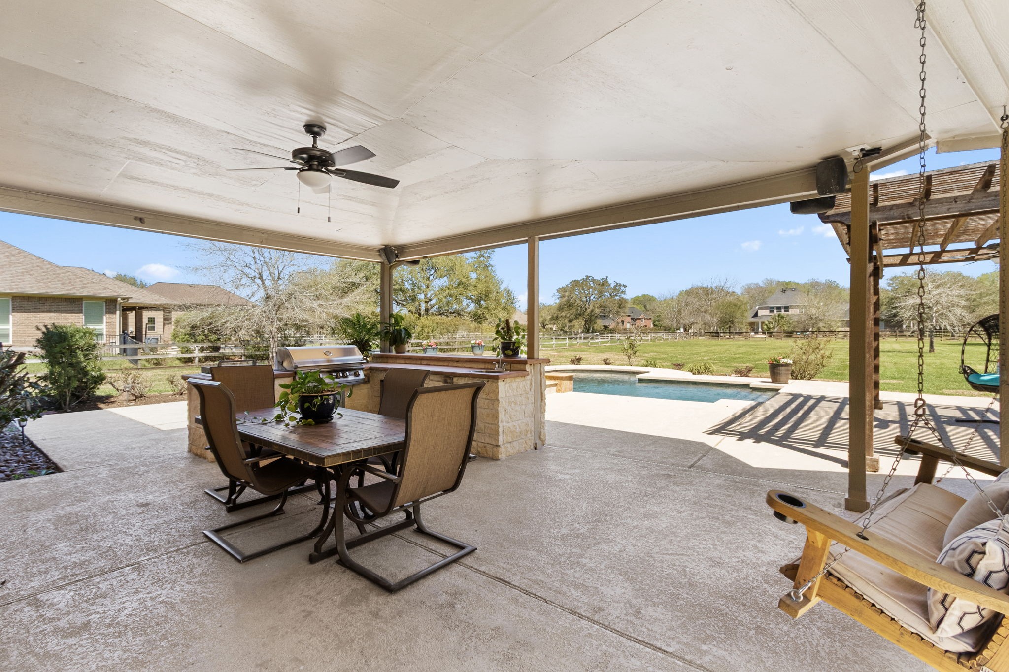 3610 Wellspring Lake Drive Fulshear, TX 77441 - Photo 29 of 45 a living room with patio furniture and a floor to ceiling window