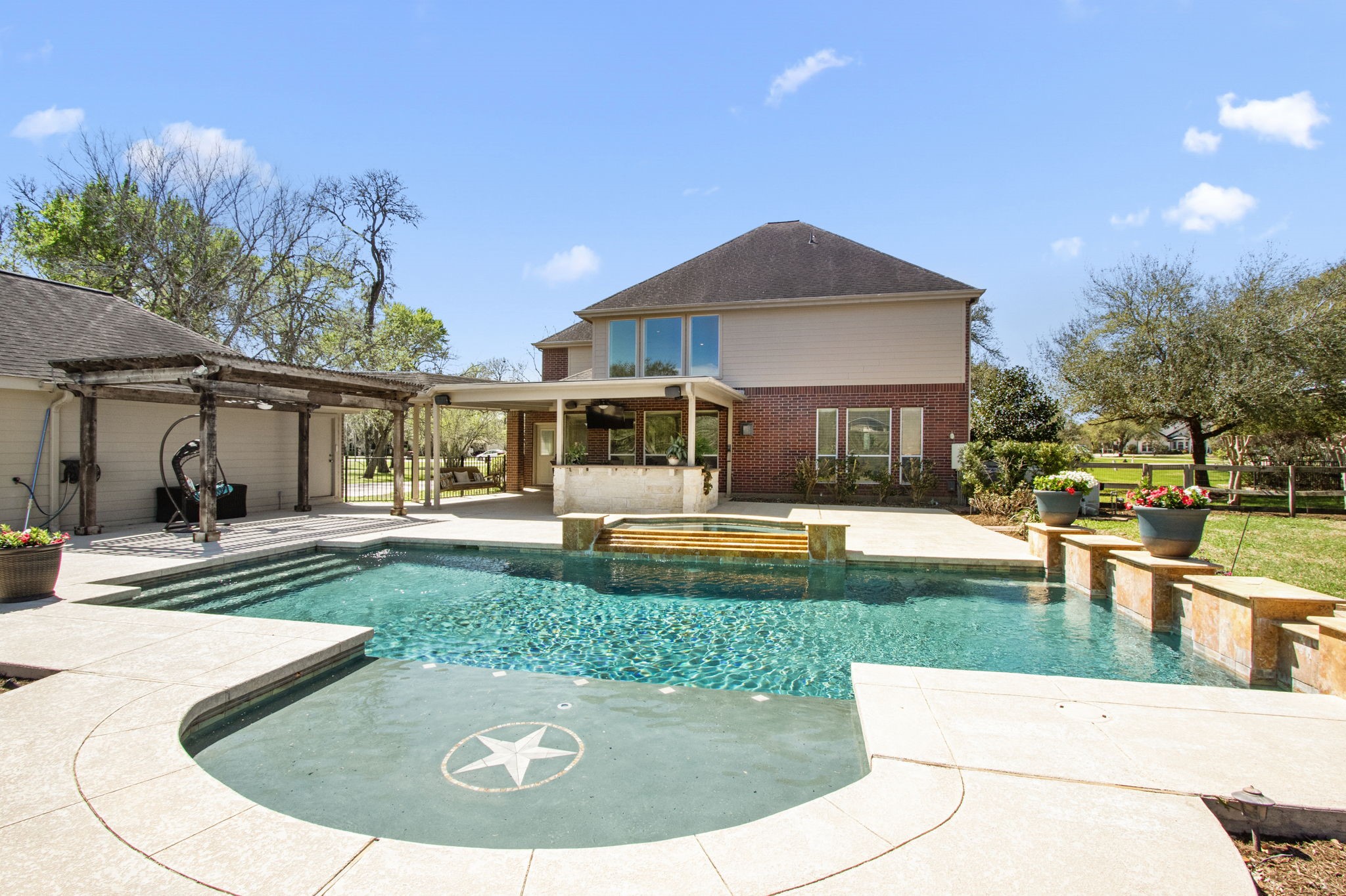3610 Wellspring Lake Drive Fulshear, TX 77441 - Photo 33 of 45 a view of a house with swimming pool
