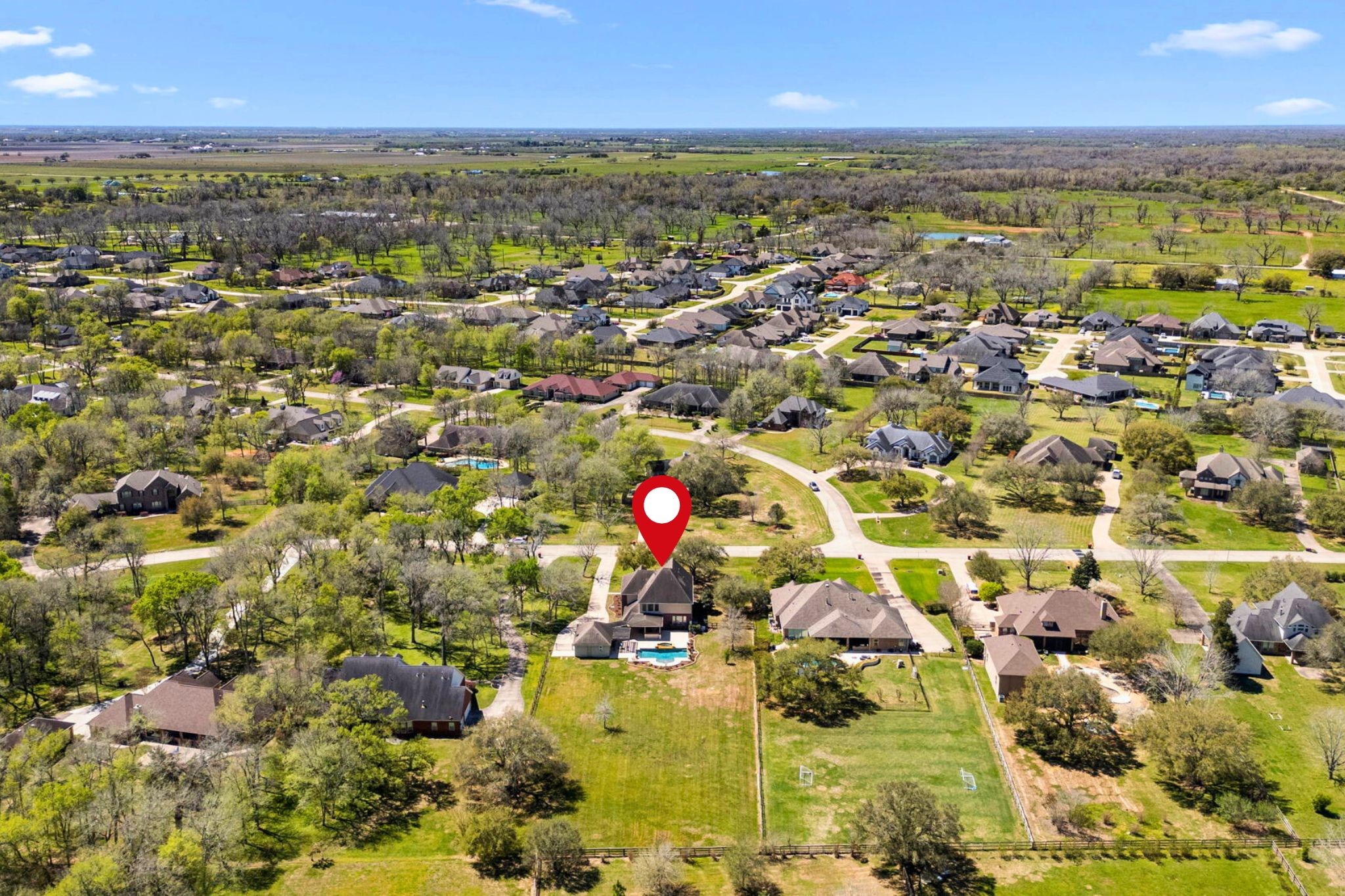 3610 Wellspring Lake Drive Fulshear, TX 77441 - Photo 41 of 45 an aerial view of residential houses with outdoor space and trees