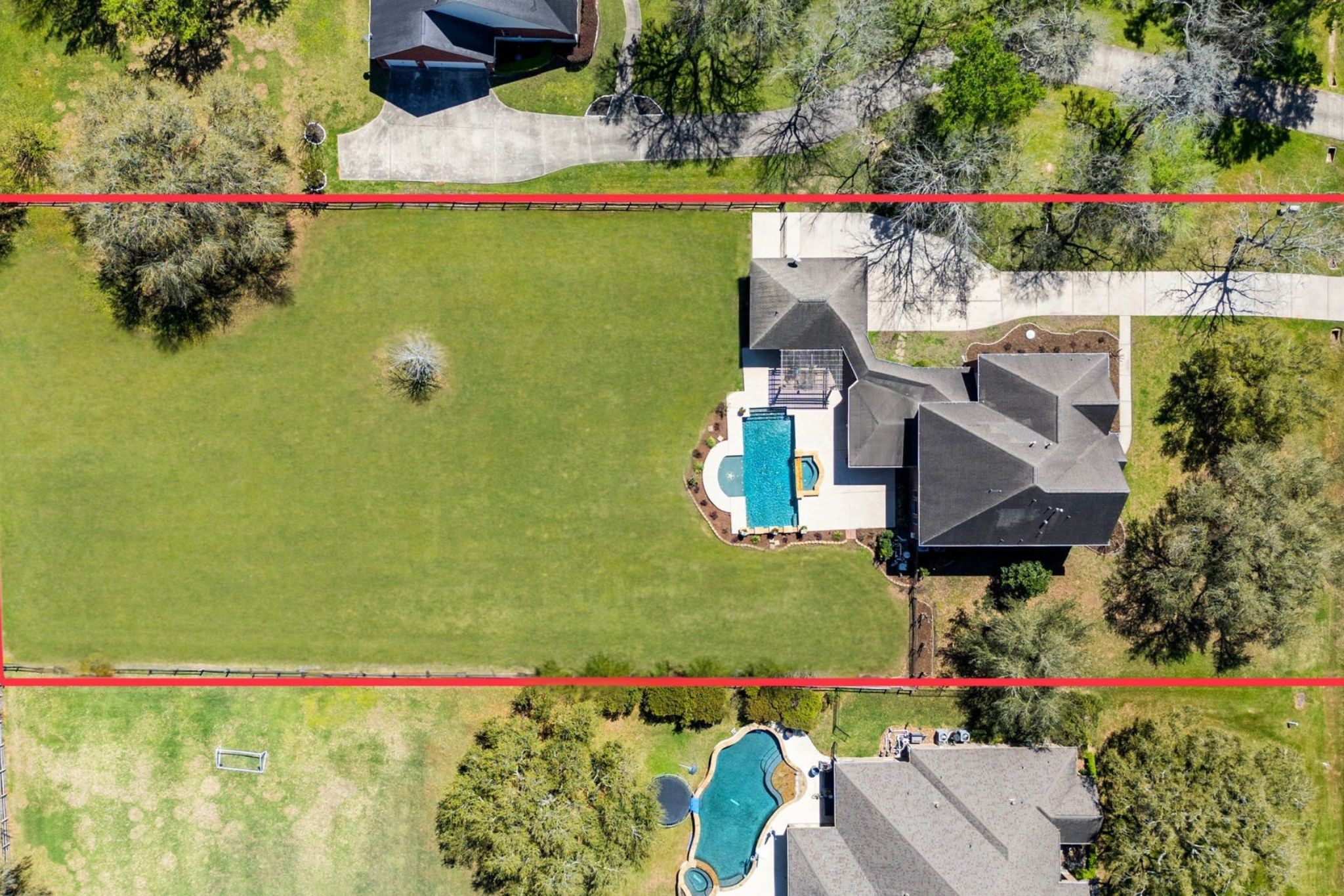 3610 Wellspring Lake Drive Fulshear, TX 77441 - Photo 42 of 45 an aerial view of a house with a garden and lake view