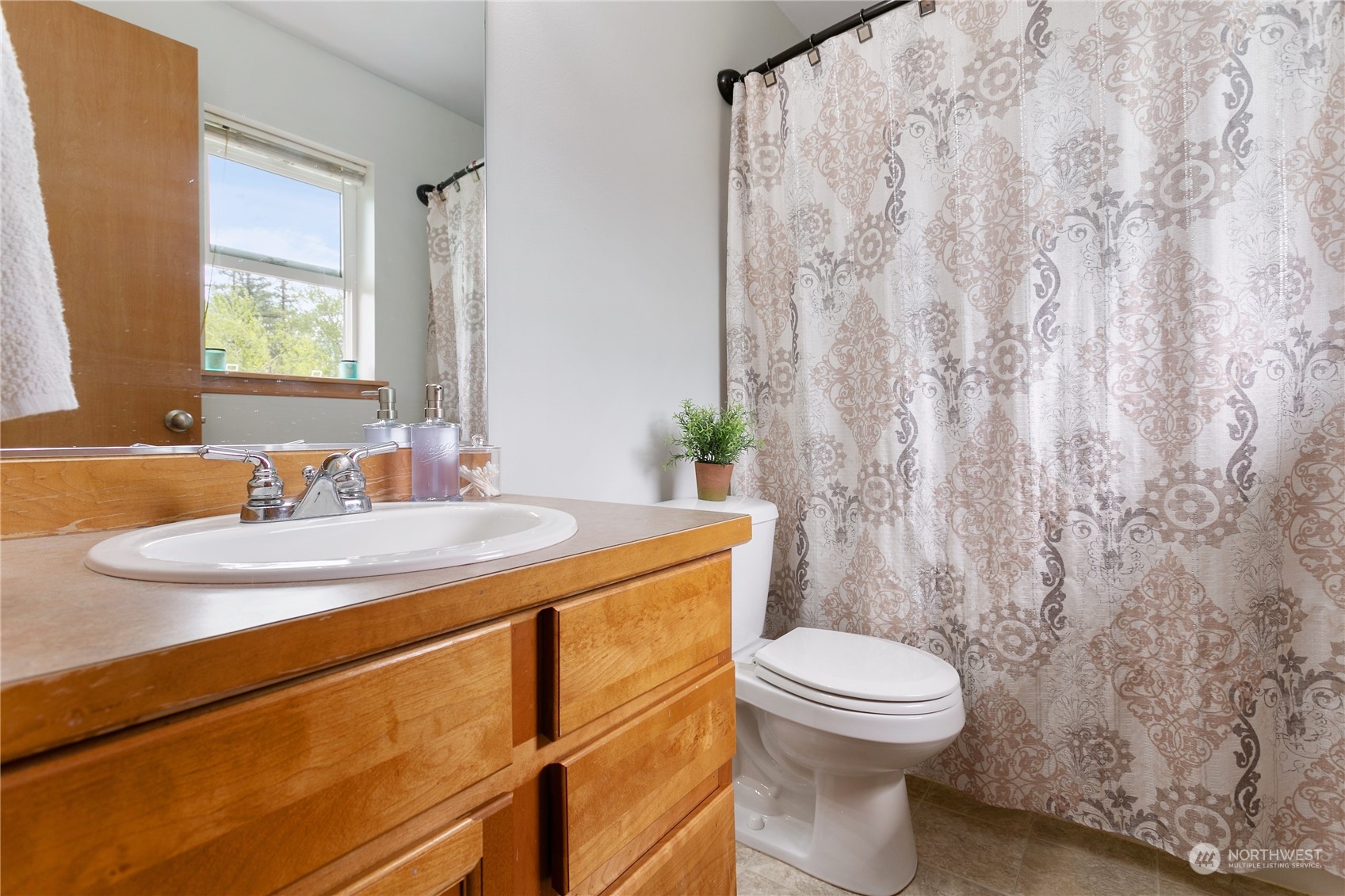 310 Allison Way Nooksack, WA 98276 - Photo 17 of 35 a bathroom with a granite countertop sink a toilet and a mirror